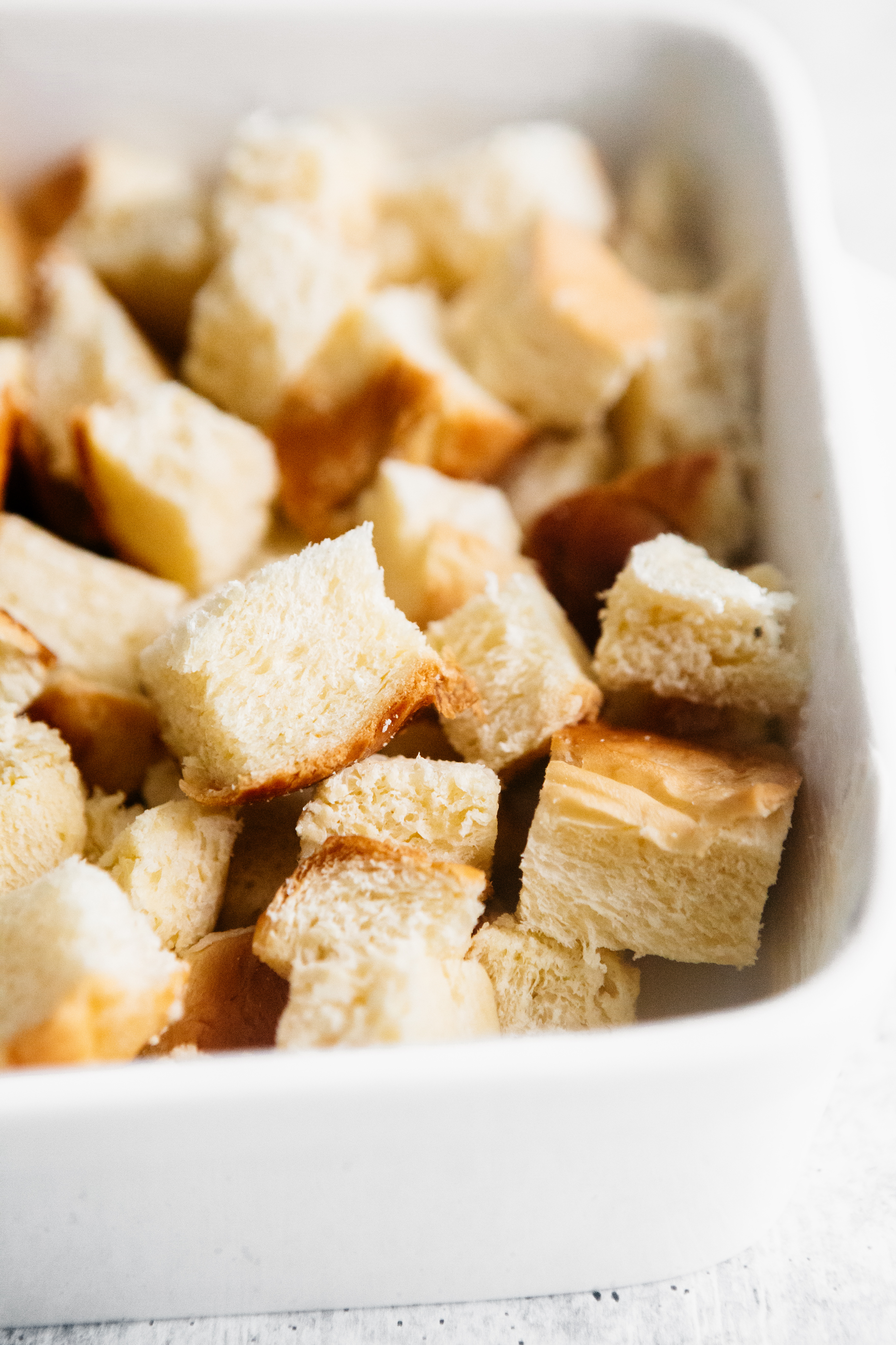 Cubed bread in a dish 