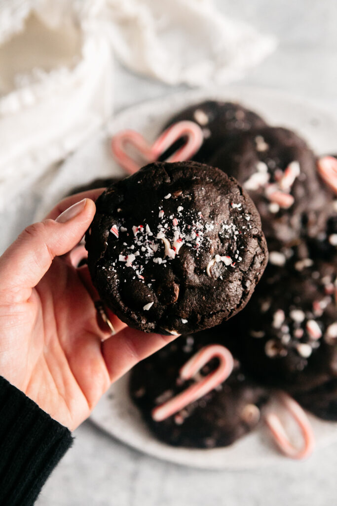 holding a Molten Peppermint Hot Cocoa Cookie