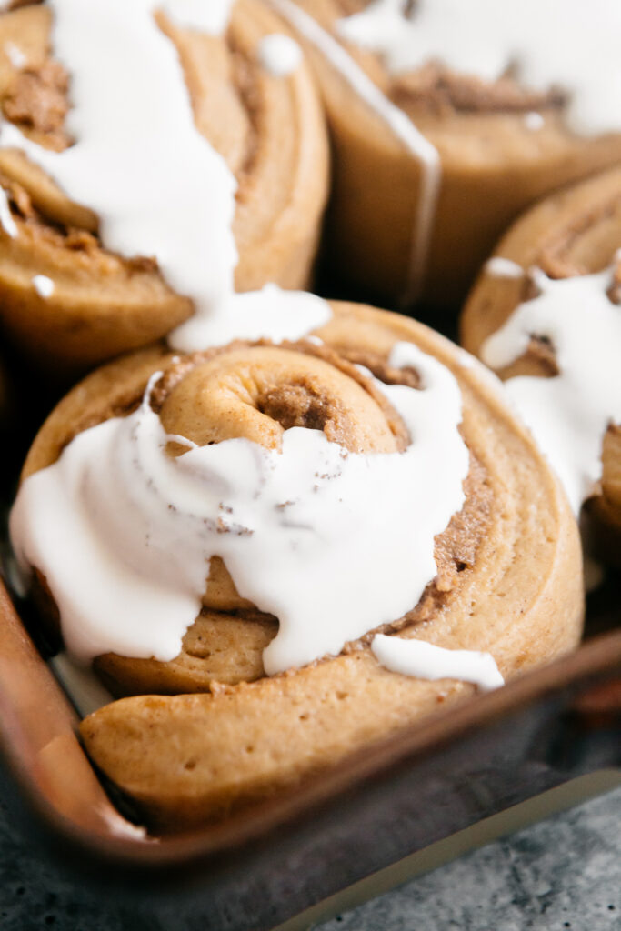 heavy cream poured on cinnamon rolls 