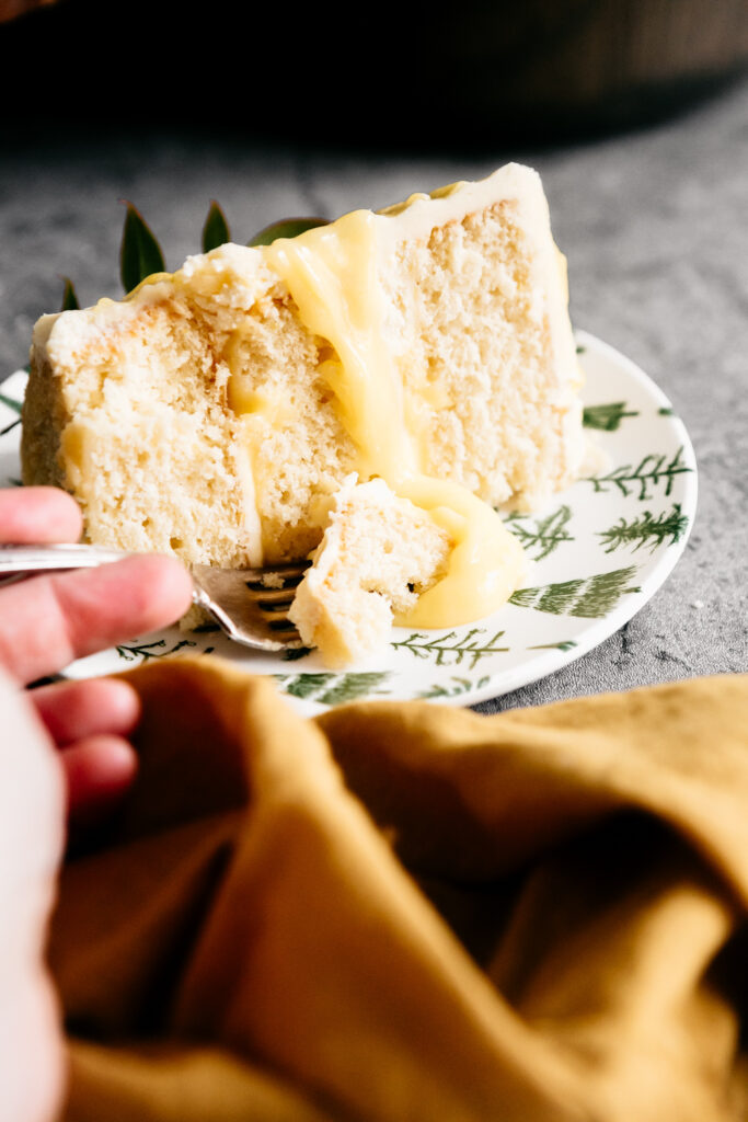 A fork taking a bite of cake 