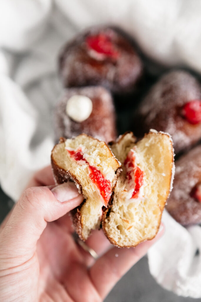 A donut split to show the filling in the middle 