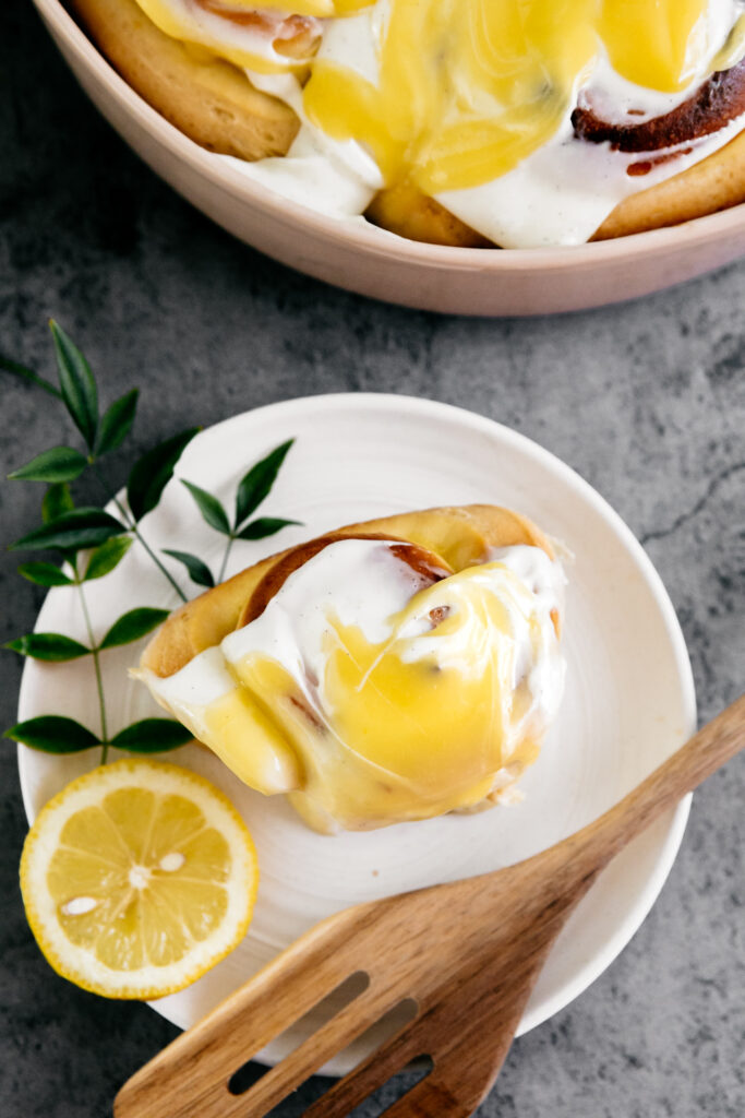 a lemon roll on a white plate 
