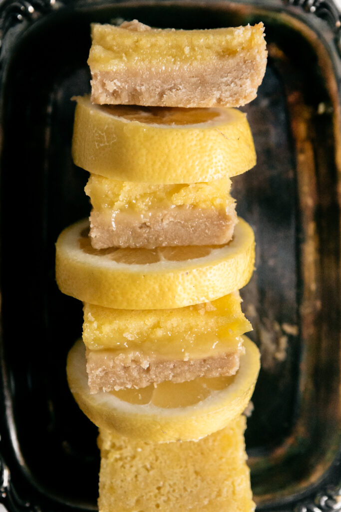 a tray of lemons and lemon bars 