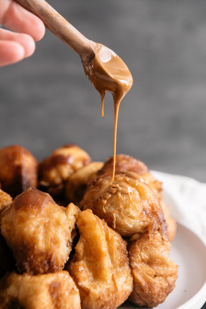 drizzling Biscoff over monkey bread 