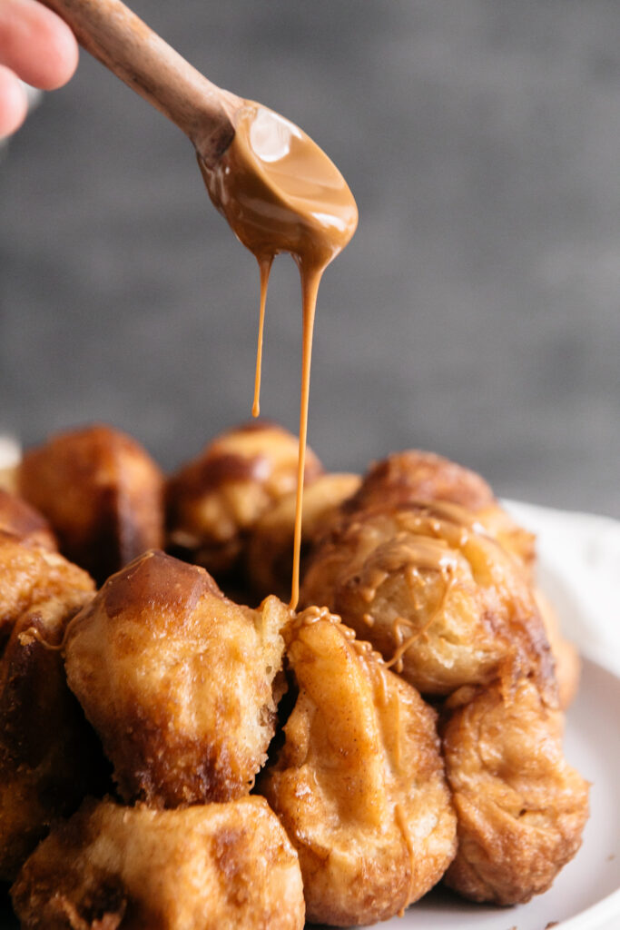 Biscoff being drizzled over monkey bread 
