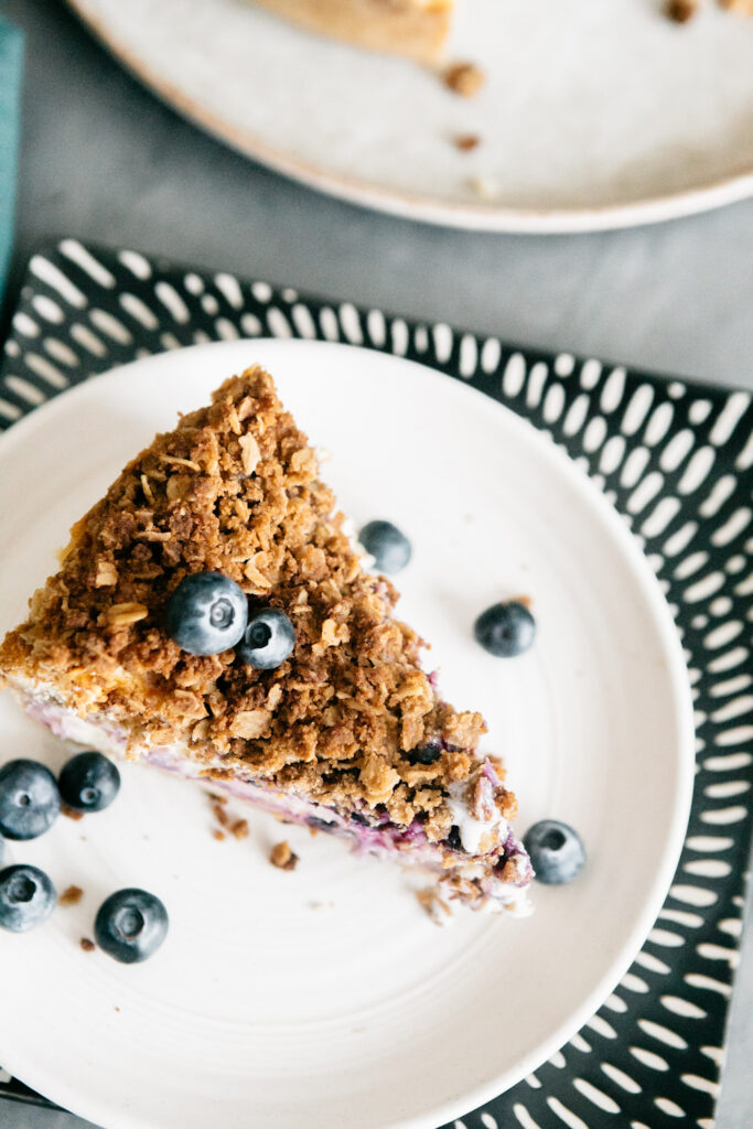 Browned Butter Blueberry Crisp Cheesecake slice 