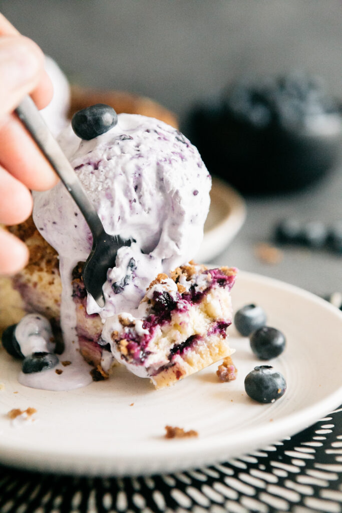 taking a bite of cheesecake 