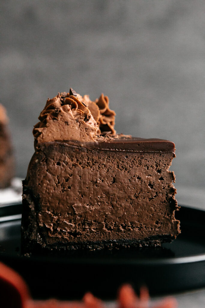 a slice of chocolate cheesecake on plate 